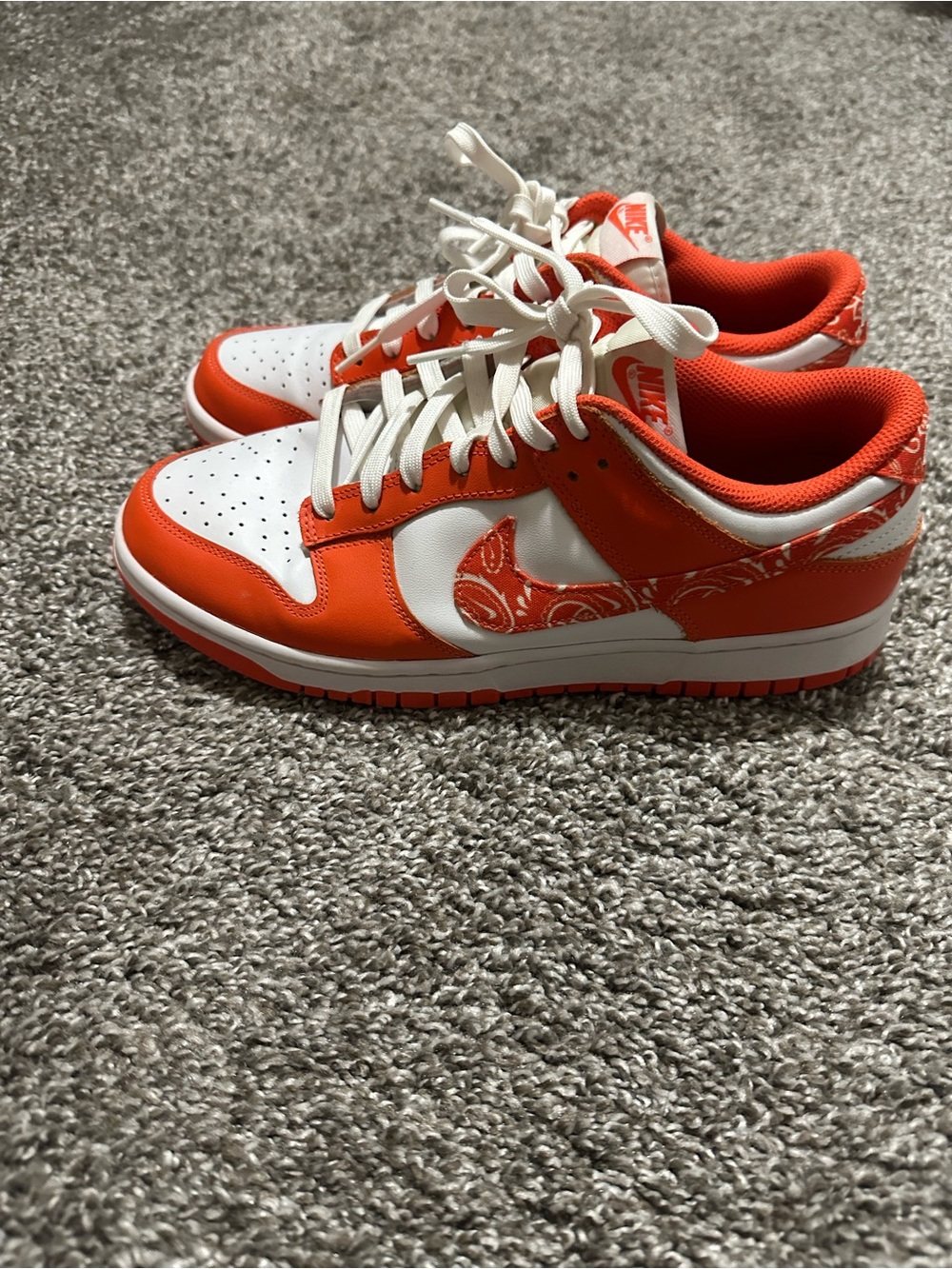 Nike Women’s Orange and White Low-Top Sneakers with Paisley Swoosh